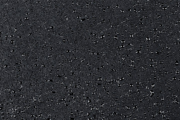 Water drops on dark stone