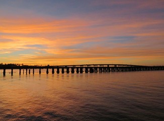 Sun setting at River walk along the Manatee River in Bradenton Florida - 164857084