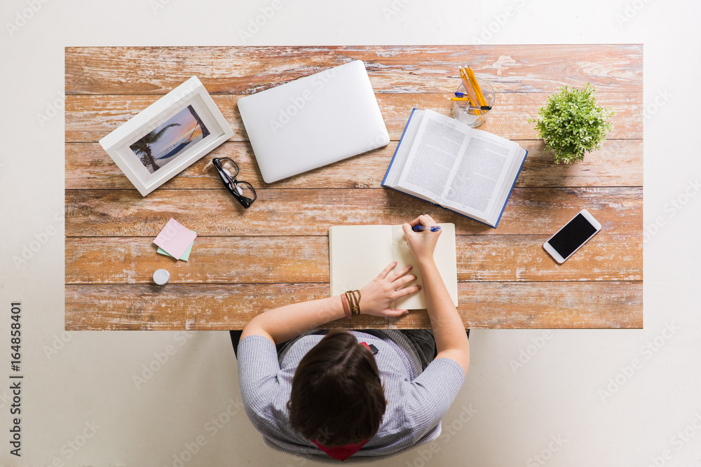 Sticker woman with book writing to notebook at table