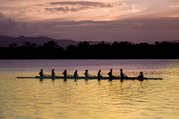 Rowers at sunset