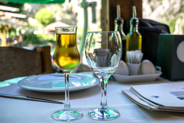 Fruit brandy or schnapps in a frosty glass on a dinner table at the restaurant