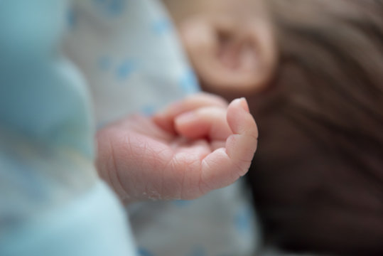 New born's finger. using as health care concept