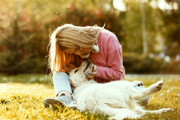 Woman is relaxing with dog