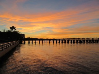 Fototapeta premium Sun setting at River walk along the Manatee River in Bradenton Florida