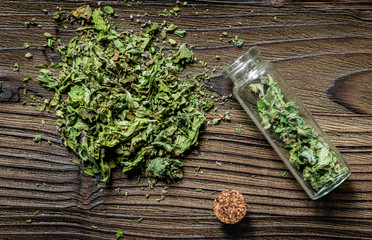 Alternative medicine. Store up medicinal herbs. Dried herbs on wooden table background
