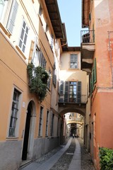 Fototapeta na wymiar Narrow old alley in Orta San Giulio at Lake Orta, Piedmont Italy