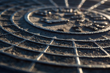 Fototapeta na wymiar Close-up of the metal manhole cover