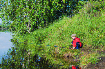 Obraz na płótnie Canvas Boy fishing summer morning