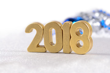 2018 year golden figures and Christmas decorations on a white