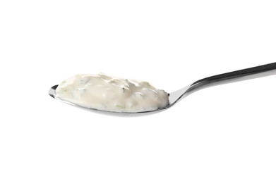 Delicious yogurt sauce in spoon isolated on white
