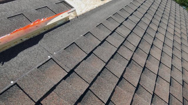 Construction of the roof. Soft roof, shingles. Roofer.