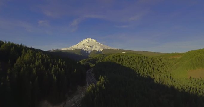 Mt. Hood Aerial Fly Away Snow Covered Mountain Surrounded by Forest