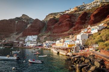 Amoudi, Santorini island, Greece. Amoudi bay is located below Oia village. Boats and taverns near...