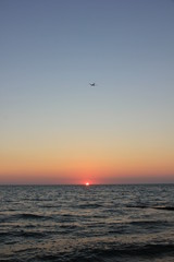 Fototapeta na wymiar plane at sunset