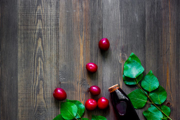 Summer tea with pulm on wooden table background top view copyspace
