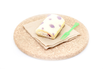 Homemade sweet roll with strawberry jam and berries roll cake, isolated on white background