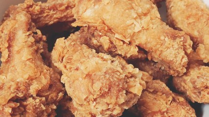 Golden brown fried chicken drumsticks. Rotation crispy fried chicken.