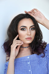 Obraz premium Beautiful stylish woman on light background