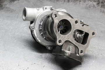new turbine car engine on a metal background