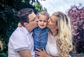 Fototapeta premium happy family: mother, father and daughter