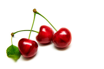 Obraz na płótnie Canvas Heart shaped cherry berries isolated on white background cutout