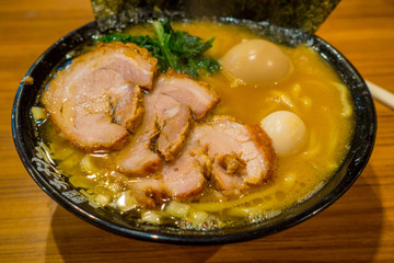 Delicious Japanese Ramen noodles in a wooden background