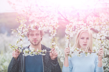 Couple in love in blossoming flower.
