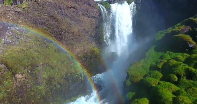 Gentle Waterfall With Rainbow In Green Rocky Valley - Aerial Footage of Dynjandi, West Fjords, Iceland
