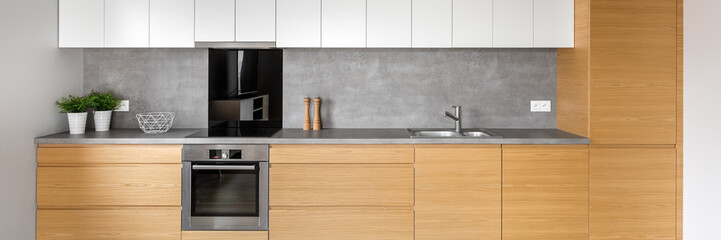 Kitchen with concrete wall