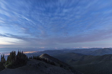 overlooking coastal mountains and ocean at night