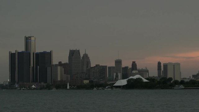 Detroit sunset skyline view from the water - Tilt Down From Grey Sky
