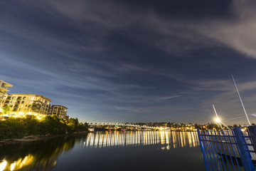 reflections in a harbor at night