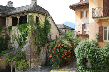 Fototapeta na wymiar Orta San Giulio at Lake Orta in summer, Piedmont Italy