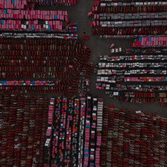 Warehouse containers in red on the street in the open air. Logistics center. Aerial view. From above