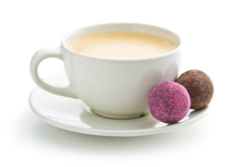 Coffee cup and sweet truffle balls.