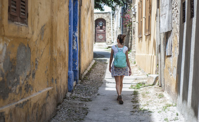 Fototapeta na wymiar woman in narrow street