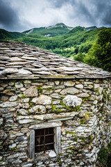 Tuscan stone-built wilderness church nestled in the mountains	