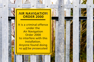 Sign at airport equipment warning that it is a criminal offence under the Air Navigation Order 2000...