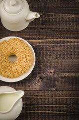 pastries and white creamer with a teapot/pastries and white creamer with a teapot top view