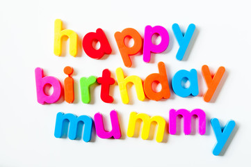 Fridge magnets magnetic letters spelling out "happy birthday mummy"
