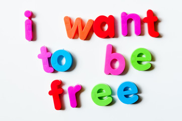 Fridge magnets magnetic letters spelling out "I want to be free"