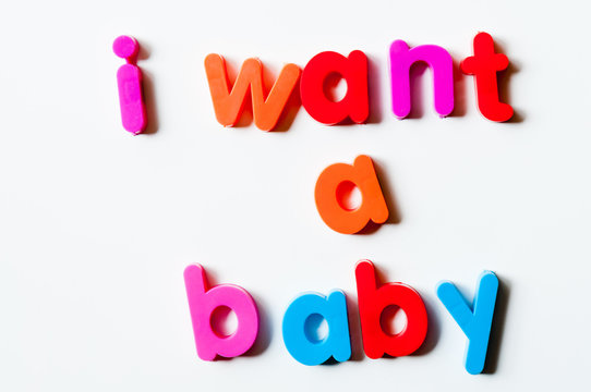 Fridge magnets magnetic letters spelling out "I want a baby"