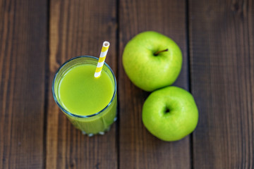 Apple juice in a glass cup. Copy space. The concept is healthy food, vegan, diet, weight loss.