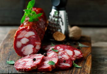 uncooked smoked sausage on a chopping board