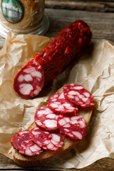 uncooked smoked sausage on a chopping board