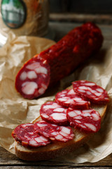 uncooked smoked sausage on a chopping board