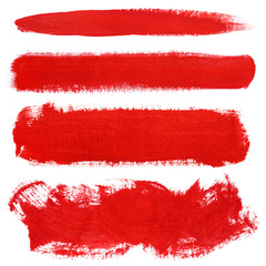 Set of red strokes of gouache paint brush isolated on white