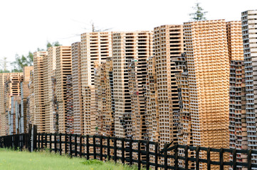 Wooden pallets piled up high at a pallet factory in Ireland.