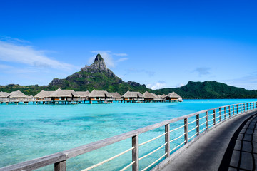 Some private lagoon huts infront of the Cloudy Mountain of Bora Bora