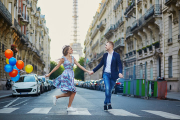 Romantic couple near the Eiffel tower in Paris